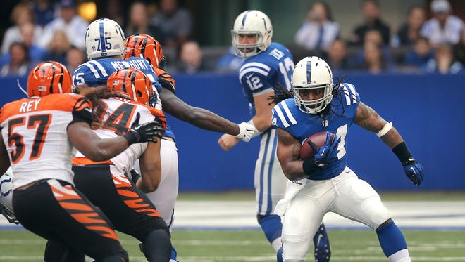 Colts running back Trent Richardson breaks through a huge hole  in the first half against Cincinnati at Lucas Oil Stadium on October 19, 2014. The Colts won 27-0.