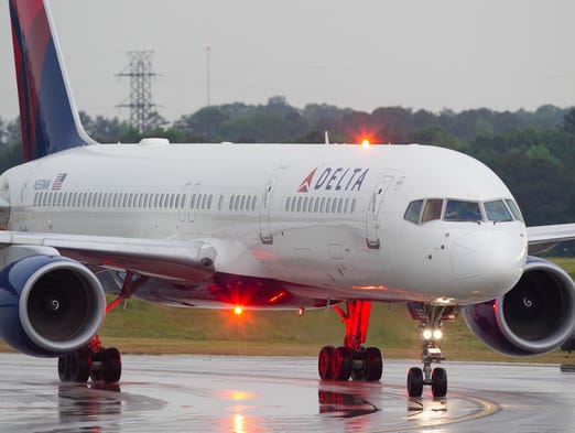 A Delta Air Lines Boeing 757-200 taxies to the gate