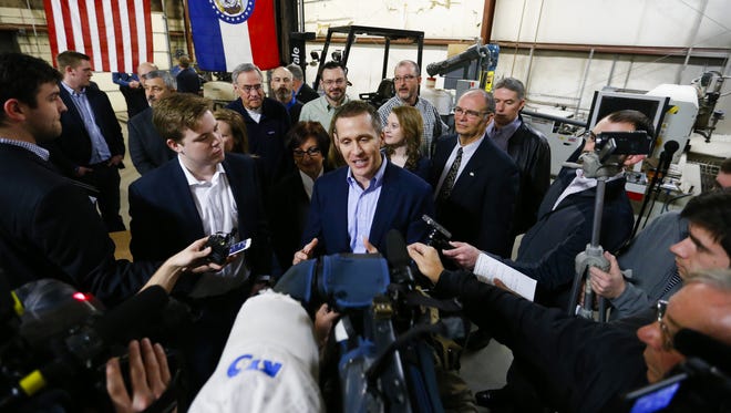 Missouri Gov. Eric Greitens takes questions from the media after signing legislation to make Missouri the 28th "right-to-work" state at the abandoned Amelex warehouse in Springfield, Mo. on Monday, Feb. 6, 2017.