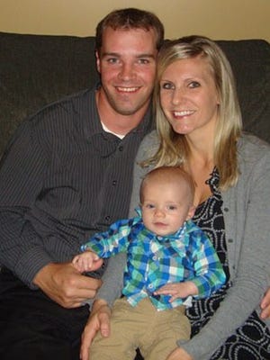 Kyle and Jenna Heckendorf hold their son Bryce in an undated family photo. Bryce died in November of a rare genetic disorder.
