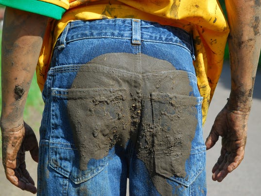 Boy in muddy jeans