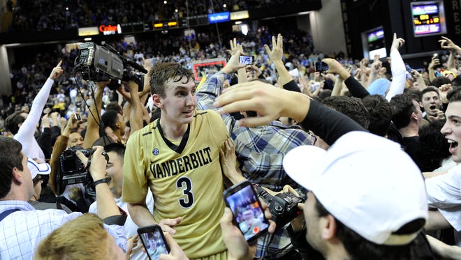Vanderbilt's Luke Kornet is surrounded by fans after beating Kentucky at Memorial Gym  on Saturday Feb. 27, 2016.