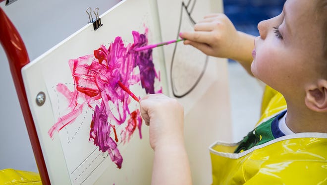 A child paints at Wes-Del Community School's preschool in this file photo.