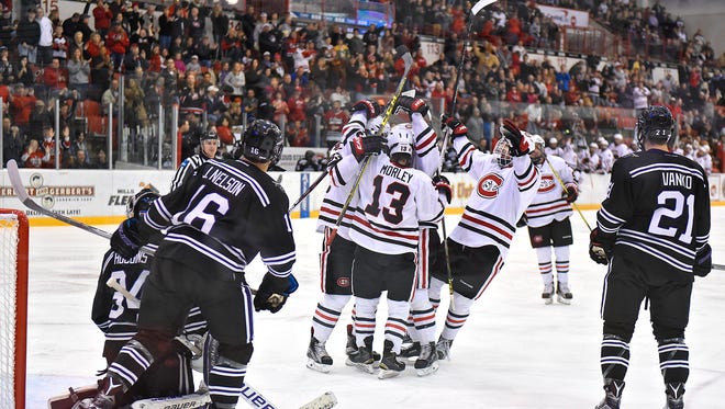 St. Cloud State players celebrate a first period goal during at the Herb Brooks National Hockey Center in St. Cloud.