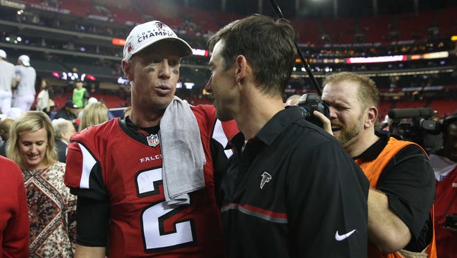 Atlanta Falcons quarterback Matt Ryan (2) speaks with offensive coordinator Kyle Shanahan after the game against the Green Bay Packers in the 2017 NFC Championship Game at the Georgia Dome.