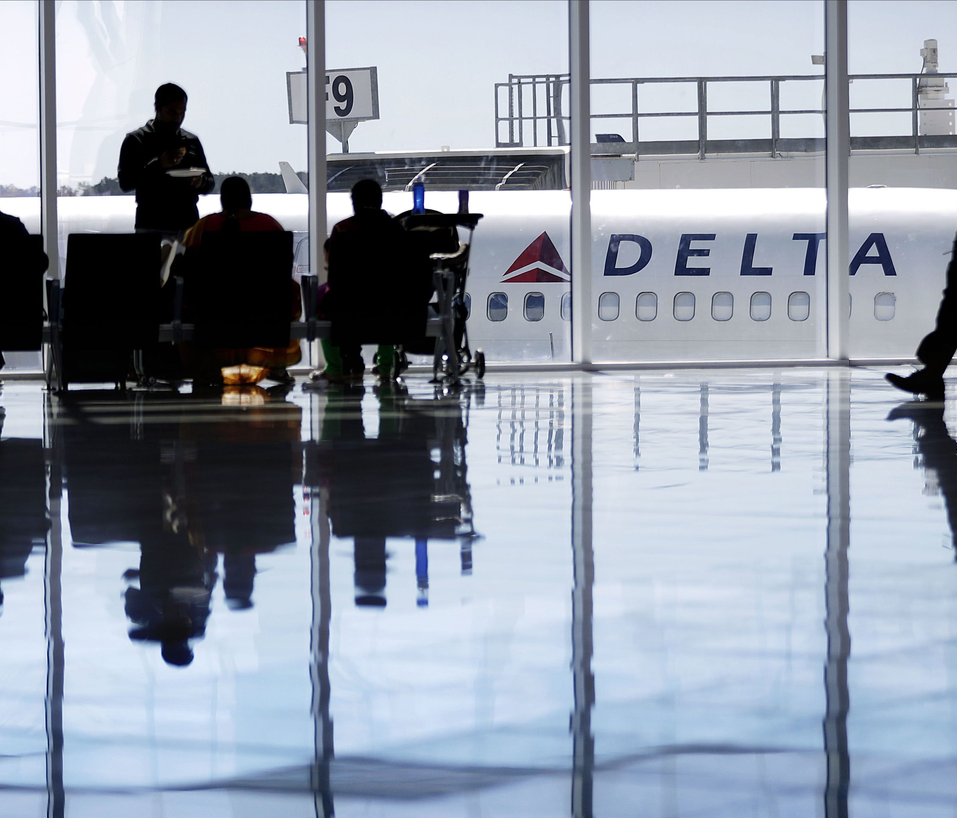 A Delta Air Lines jet sits at a gate at Atlanta's Hartsfield-Jackson International Airport on Oct. 13, 2016.