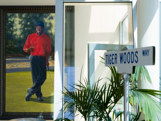 A portrait of Tiger Woods hangs in the welcome lobby