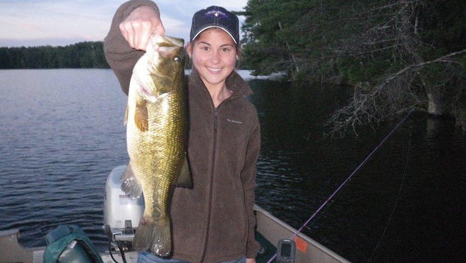 Skip Sommerfeldt’s daughter, Beth, with a big largemouth caught in Price County