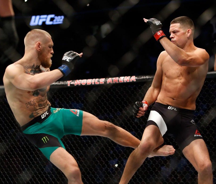 In this picture from Aug. 20, 2016, Conor McGregor, left, kicks Nate Diaz during their welterweight rematch at the UFC 202 event at T-Mobile Arena in Las Vegas.