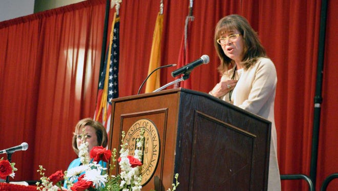 New Mexico Higher Education Secretary Barbara Damron, right, addresses a group of educators on Sept. 9, at the University of New Mexico in Albuquerque, N.M.. At left, New Mexico Gov. Susana Martinez, left, listens. Damon and Martinez announced a series of proposals on Sept. 9  aimed at increasing the state's college graduation rates.