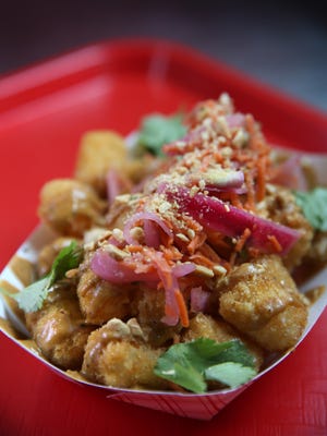 Peanut curry tots at Playhouse Swillburger in Rochester on Thursday, Jan. 26, 2017.
