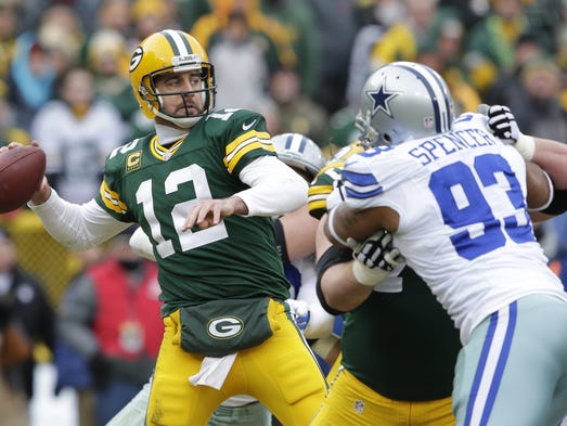 Green Bay Packers quarterback Aaron Rodgers (12) passes