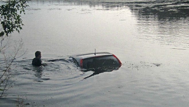 Adams County Sheriff's deputies extricated a woman from a submerged vehicle Friday morning in Big Roche a Cri Lake in the town of Preston.