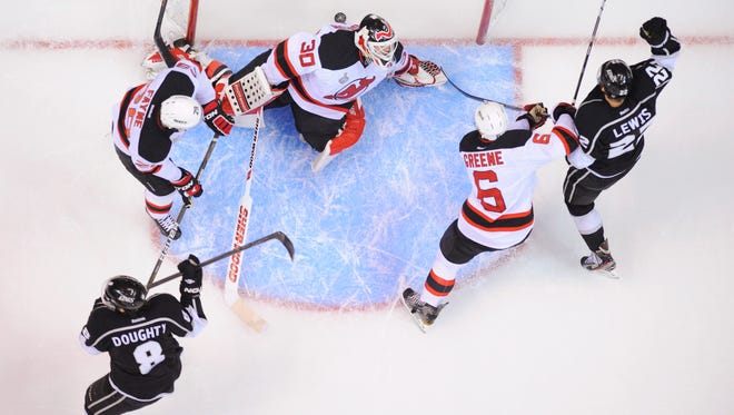 The Devils and Kings during the 2012 Stanley Cup Final. Devils defenseman Andy Greene (6) is one of three New Jersey players remaining on the roster from that series, which was won by the Kings in six games. (AP Photo/Mark Terrill)