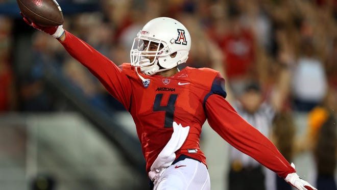 Arizona wide receiver David Richards (4) shows off the ball after hauling in a touchdown catch against Northern Arizona in the second quarter of their game at Arizona Stadium, Saturday Sept. 19, 2015, Tucson, Ariz.
