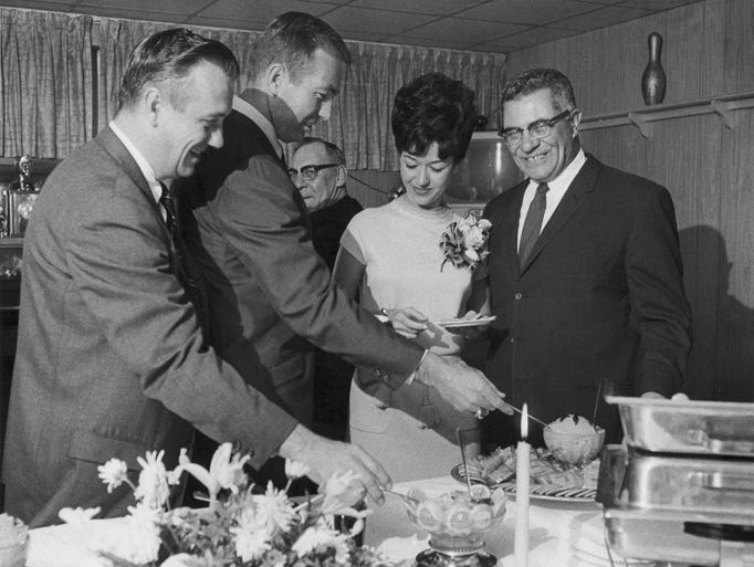 Packers quarterback Bart Starr and his wife Cherry, center, join Packers coach Vince Lombardi, right, at the hors d'oeuvres table at the Elks Sports Awards Banquet in Green Bay on April 24, 1967. At left is Notre Dame basketball coach Johnny Dee, who was Starr's backfield coach at the University of Alabama. Press-Gazette archives