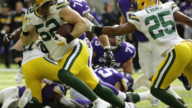Green Bay Packers outside linebacker Clay Matthews (52) scoops up a fumble during the second quarter of their game against the Minnesota Vikings Sunday, October 5, 2017 at U.S. Bank Stadium in Minneapolis, Minn.

MARK HOFFMAN/MILWAUKEE JOURNAL SENTINEL