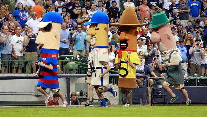 The popular Klement's Racing Sausages begin their regular middle-of-the-sixth-inning race at Miller Park during the Brewers' game against the Chicago Cubs June 25, 2013. The Racing Sausages were celebrating their 20th year with the Brewers.