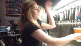 Rosie Reilly pours a Lyin' Eyes beer Thursday at Roak.
