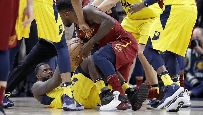 Indiana Pacers guard Lance Stephenson (1) wrestles for the ball with Cleveland Cavaliers forward Jeff Green (32) late in the second half of Game 4 at Bankers Life Fieldhouse on Sunday, April 22, 2018. Stephenson was called for a foul on the play. The Cleveland Cavaliers defeated the Indiana Pacers 104-100.