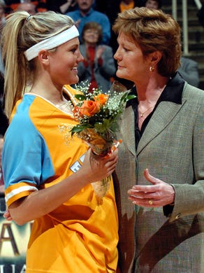 UT head coach Pat Summitt presents flowers to senior Brittany Jackson befor...