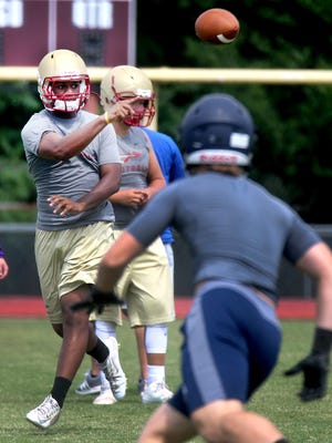 Riverdale's quarterback Christian Souffront passes during the school's annual 7-on-7 passing tournament at the school on Thursday July 14, 2016.