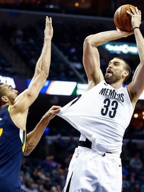 Memphis Grizzlies center Marc Gasol (right) is fouled