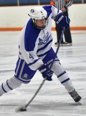 Lakeland’s Kyle Soderlund unloads on the shot during Saturday’s game against rival Milford at the Lakeland Ice Arena.