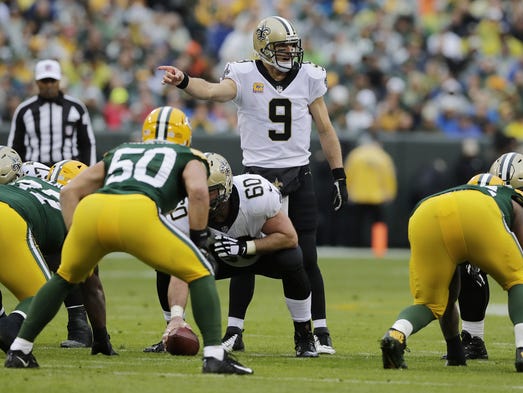 New Orleans Saints quarterback Drew Brees (9) directs