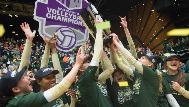 The CSU volleyball team celebrates a Mountain West Championship after a 3-1 win over UC Davis at Moby Arena on Saturday, November 25, 2017. 