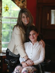 Anna Landre with her mother Laura Landre in the Howell home.