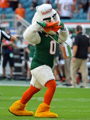 The Miami Hurricanes mascot Sebastian dances on the
