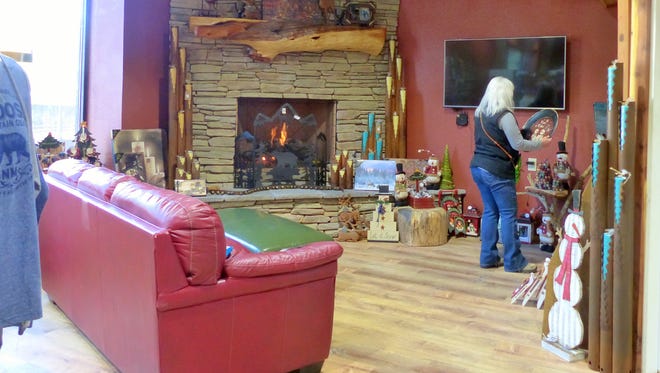 A fireplace creates a relaxing atmosphere for visitors signing in for lodging in Upper Canyon.