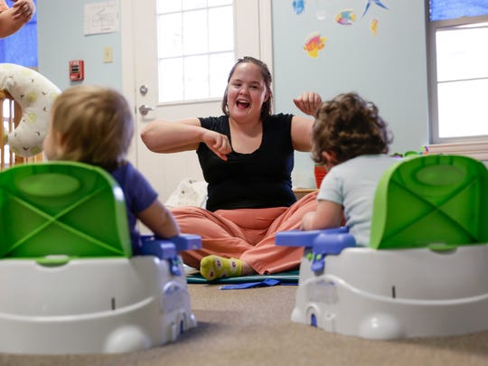 Child Care Costs More Than College - kira deforest sings with children at creative learning