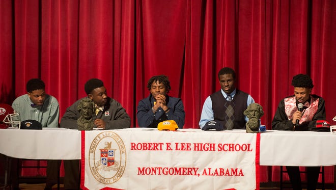 From left, Lee football players Miles Evans, signing with Stillman College, Ta'wonya Carter, invited to play football at Huntingdon College, Adrian King, signing with Tennessee Chattanooga, Joshua Smiley, signing with West Florida and Marquis Howard, signing with Northern Illinois, speak to football players and family on Wednesday February 4, 2015 at Lee High School in Montgomery, Ala.