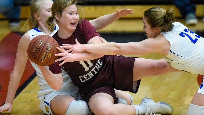 Kenzie Schmiesing of Sauk Centre tries to get off a pass after recovering a loose ball during the first half of the Section 6-2A finals Friday, March 9, at Halenbeck Hall in St. Cloud.