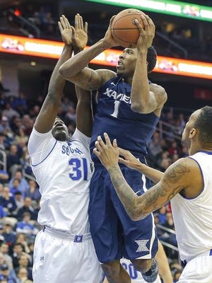 The rebounding subplot of Saturday's game between No. 5 Xavier and Seton Hall will be impacted by Angel Delgado (left) and Jalen Reynolds, shown here in last year's game in New Jersey.