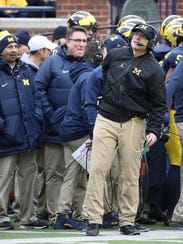 Michigan coach Jim Harbaugh on the sideline in the