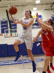 Going in for a layup is Salem's Maddie Kernahan (10),