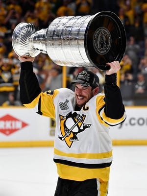 Pittsburgh Penguins center Sidney Crosby hoists the Stanley Cup after defeating the Nashville Predators in game six of the 2017 Stanley Cup Final at Bridgestone Arena. This year's Finals was the most-watched ever for a series not involving an original six team.