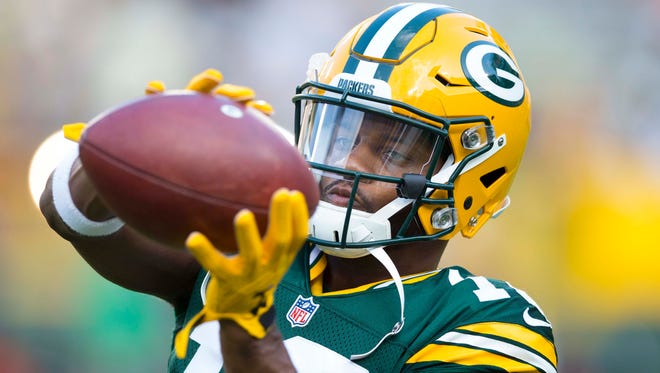 Aug 18, 2016; Green Bay, WI, USA;  Green Bay Packers wide receiver Randall Cobb (18) catches a pass during warmups prior to the game against the Oakland Raiders at Lambeau Field.