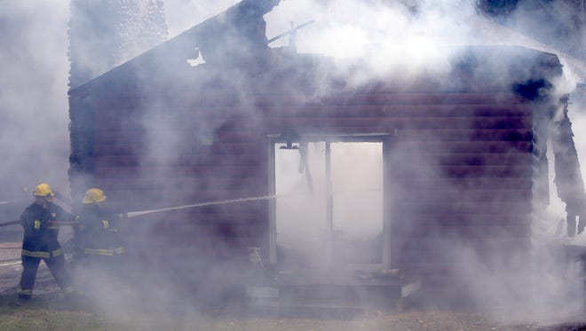 Firefighters work to extinguish house fire at W7019 Detention Road Tuesday, April 21, 2015, in the Town of Bovina, Wis. According to Shiocton-Bovina Fire Chief Butch Bunnell fire departments from Shiocton-Bovina, Black Creek, Navarino and Nichols-Lessor responded.
