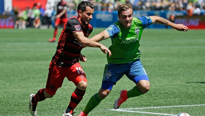 Seattle Sounders forward Jordan Morris, right, challenges Portland Timbers' midfielder Sebastian Blanco, left, in the first half of an MLS soccer match, Saturday, May 27, 2017, in Seattle. (AP Photo/Ted S. Warren)