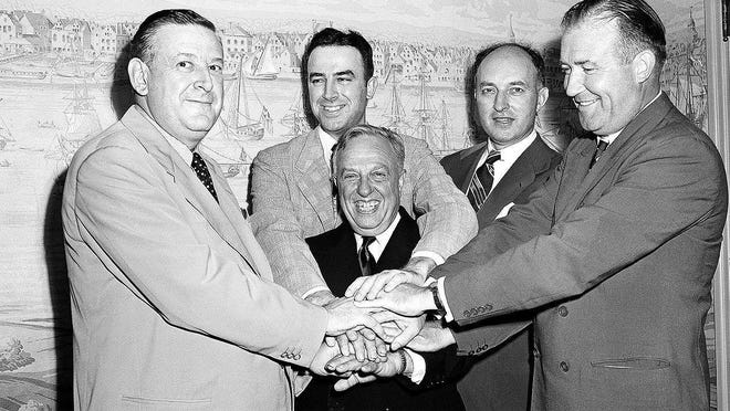 Leo Ferris, second from left in the back, appears in this well-known photo from Aug. 3, 1949 in New York after the National Basketball League and Basketball Association of America agreed to a merger, forming the National Basketball Association. NBA President Maurice Podoloff is in the center. From left around Ferris are Ike Duffey, Ned Irish and Walter Brown.