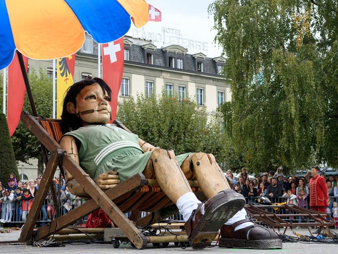 Giant puppets highlight Switzerland street performance