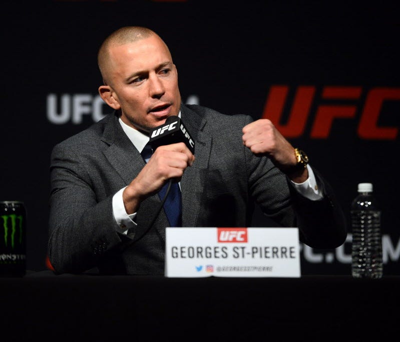 Georges St-Pierre speaks during a press conference to promote his middleweight title bout against Michael Bisping (not pictured) prior to weigh ins for UFC 209 at T-Mobile Arena.