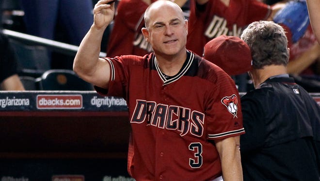 Diamondbacks manager Chip Hale salutes the fans for their support during the season during the middle of the sixth inning of a baseball game against the San Diego Padres, Sunday, Oct. 2, 2016, in Phoenix.