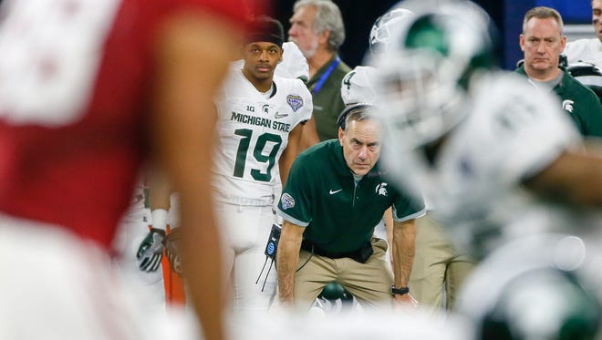 Michigan State football coach Mark Dantonio watches one of the last plays during the Cotton Bowl against Alabama in Arlington, Texas, on Dec. 31, 2015.