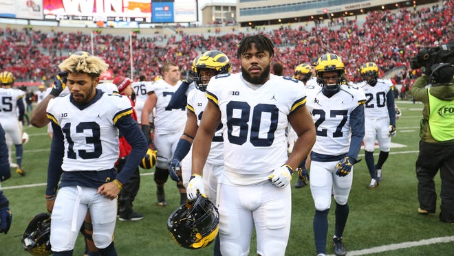 Michigan players leave the field after the 24-10 loss to Wisconsin on Saturday, Nov. 18, 2017, at Camp Randall Stadium in Madison, Wis.