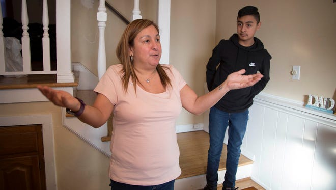 After her husband Jorge Garcia was deported to Mexico, Cindy Garcia talks in her mother's Lincoln Park home about not giving up hope as her son Jorge looks on January 2018.